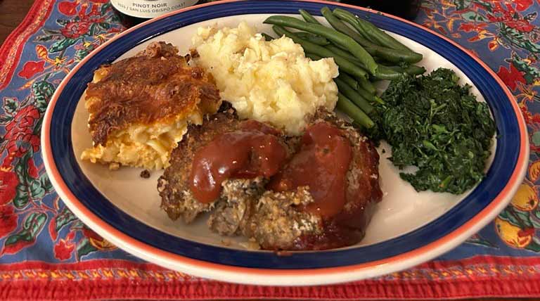 Meatloaf potatoes and vegetable on a dinner plate